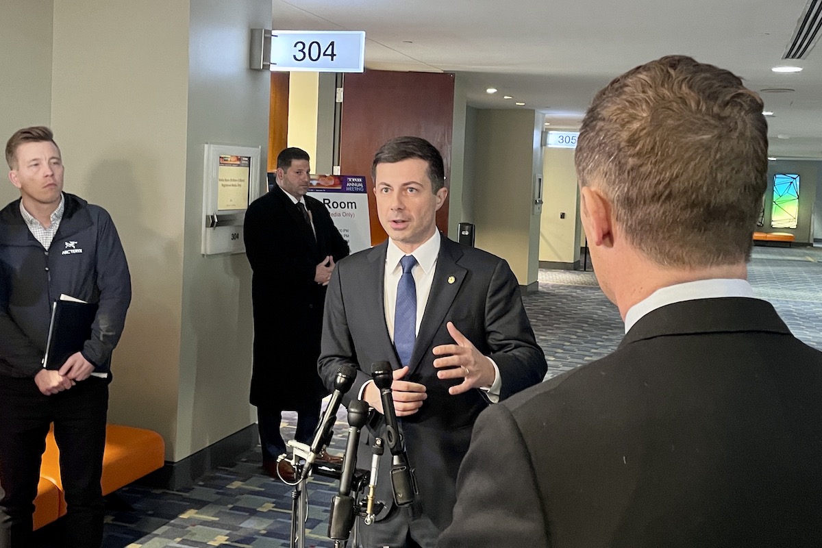Transportation Secretary Pete Buttigieg speaks to reporters