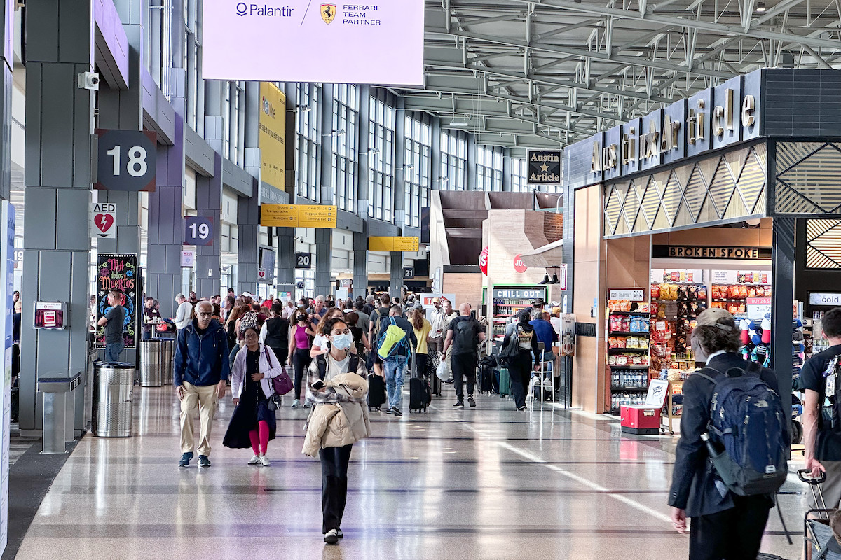 Travelers walk through the Austin Airport