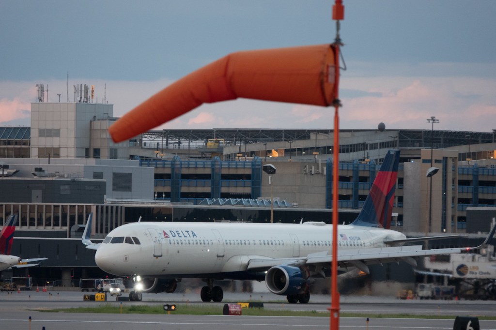 A Delta plane taxis at its Minneapolis-St. Paul hub